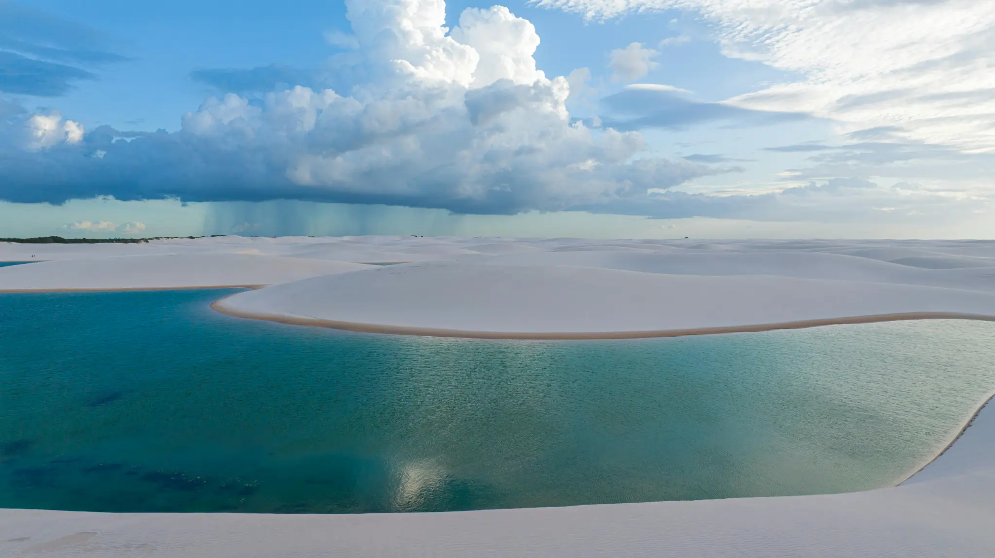 Dunes and lagoons beneath a dramatic sky in Lençóis Maranhenses