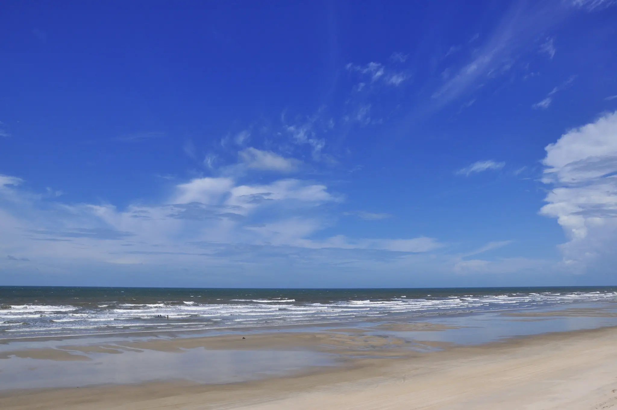 Blue ocean and a quiet beach along the Route of Emotions